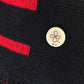 Poncho marinière marine et rouge à franges 100% laine vierge. ET D'EMIE marque française écoresponsable pour la famille, pour grandir et faire grandir, créée et fabriquée en France. 